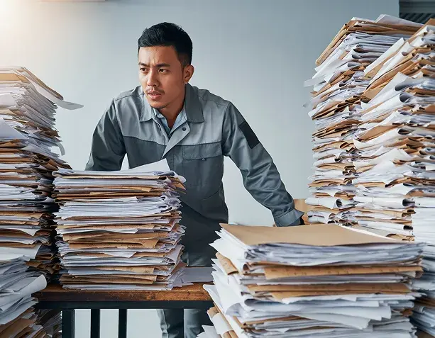 industry-paper-desk-frustrated-person